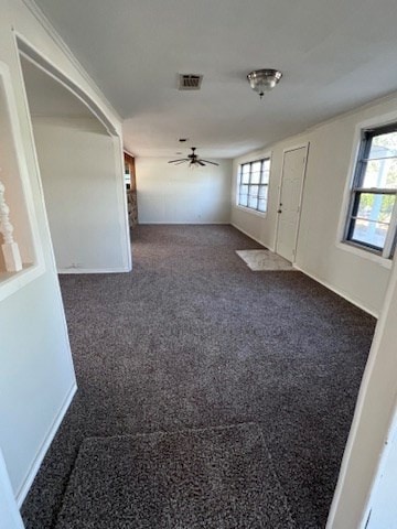 carpeted empty room featuring ceiling fan