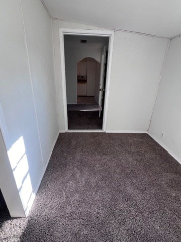 interior space with dark colored carpet