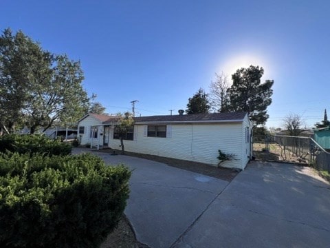 back of property with a patio