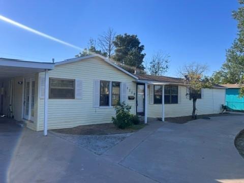 view of front of home featuring a carport