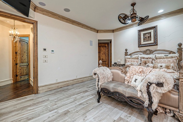 bedroom featuring a chandelier, hardwood / wood-style flooring, and ornamental molding