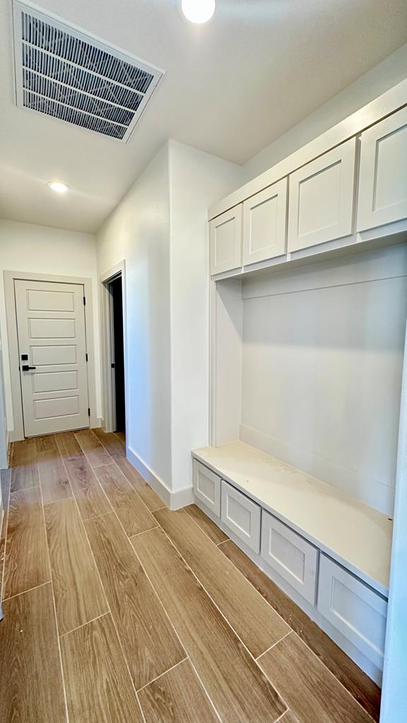 2217 S County Rd 1059, Midland, TX 79706 - mudroom with recessed lighting, baseboards, visible vents, and light wood-type flooring