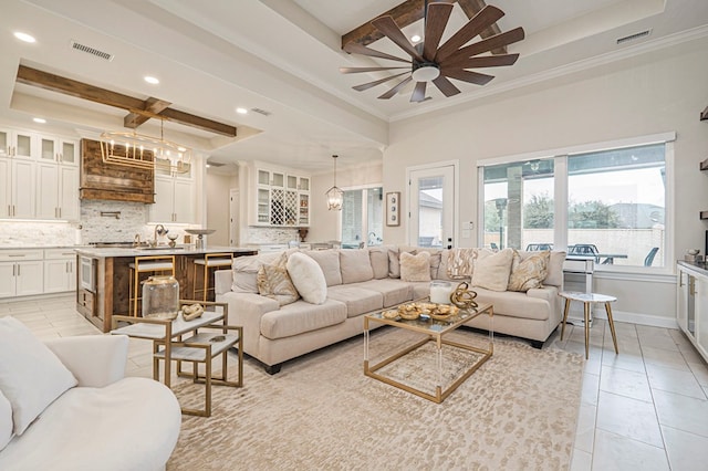 living room featuring a tray ceiling, coffered ceiling, beamed ceiling, and light tile patterned flooring