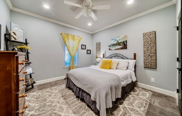 bedroom featuring hardwood / wood-style flooring, ceiling fan, and ornamental molding