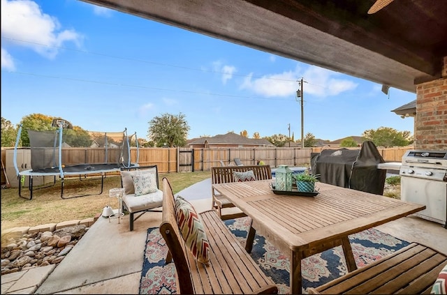 view of patio featuring a trampoline and area for grilling