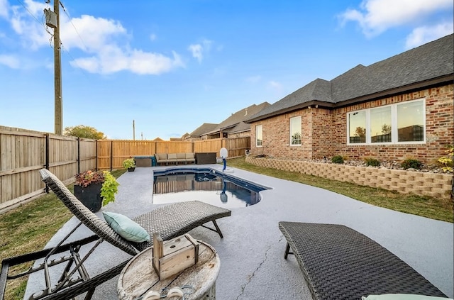 view of patio / terrace featuring outdoor lounge area and a fenced in pool