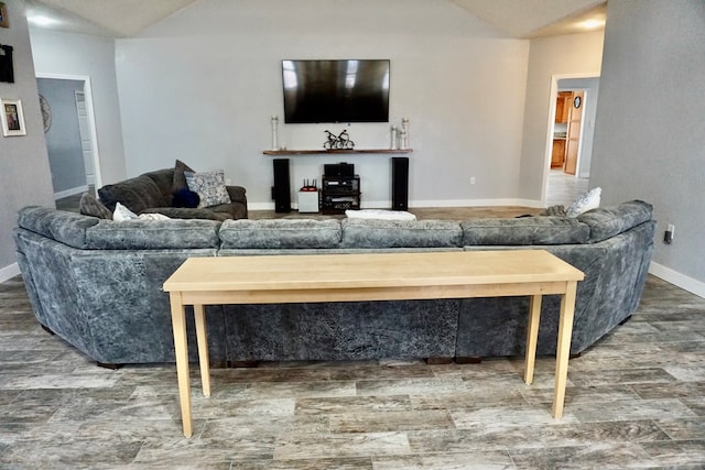 living room featuring baseboards and wood finished floors