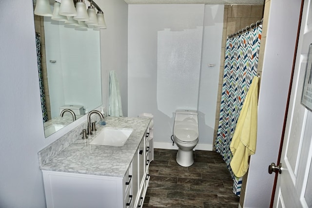 full bathroom featuring vanity, toilet, a shower with shower curtain, baseboards, and wood finished floors