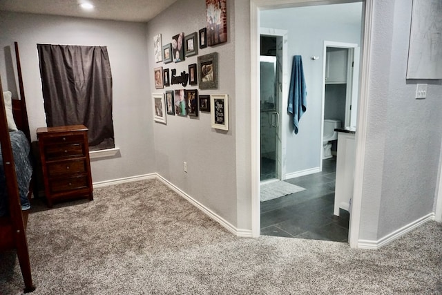 corridor featuring carpet floors, baseboards, and recessed lighting