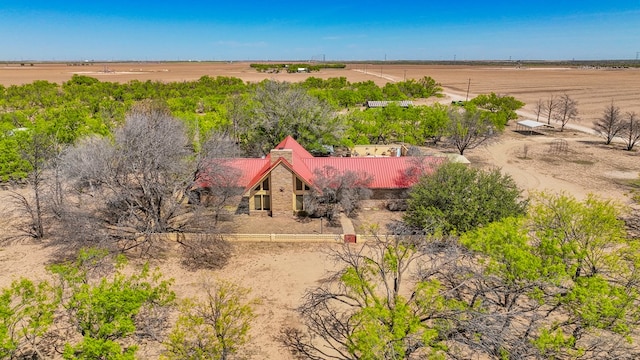 birds eye view of property with a rural view