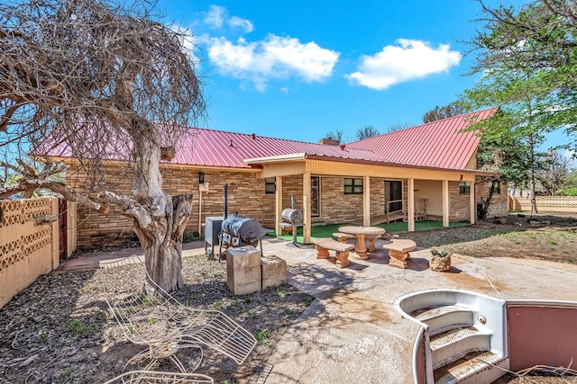 rear view of property with a patio