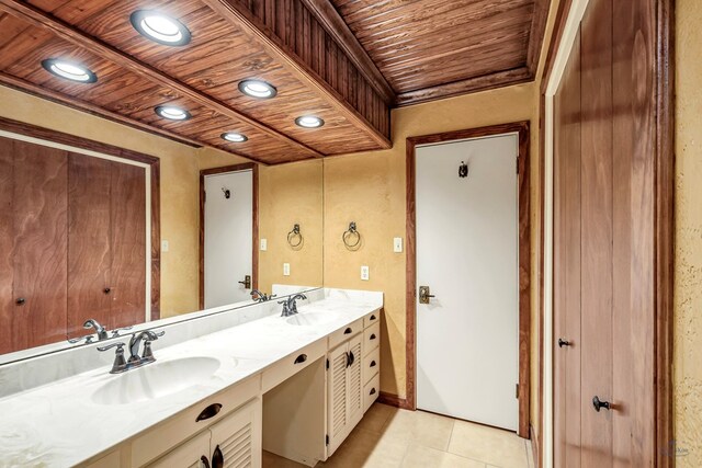 bathroom with tile patterned flooring, vanity, and wood ceiling