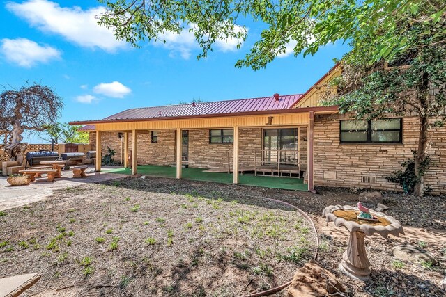 rear view of house featuring a patio area