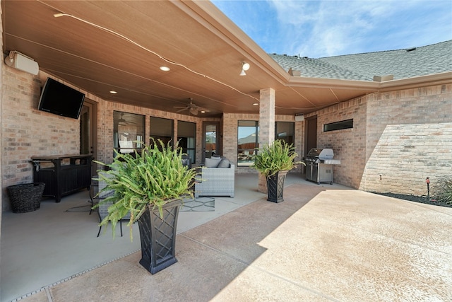 view of patio with ceiling fan and grilling area