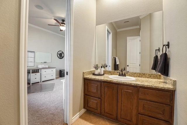 bathroom featuring vanity, ceiling fan, and crown molding