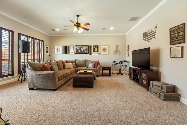 carpeted living room featuring ceiling fan and crown molding