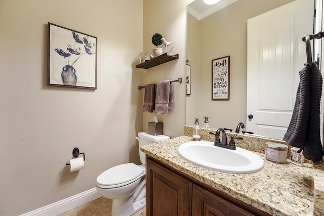 bathroom featuring toilet, tile patterned flooring, vanity, and ornamental molding