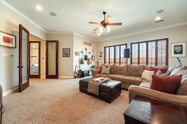 carpeted living room featuring french doors, ceiling fan, and crown molding