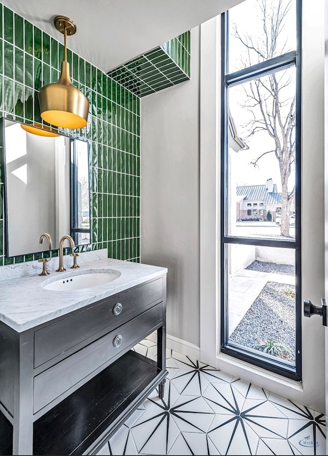 bathroom featuring plenty of natural light and vanity