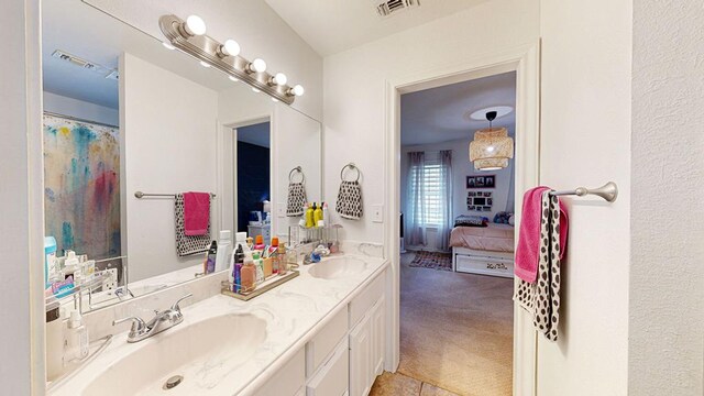 bathroom with tile patterned flooring and vanity