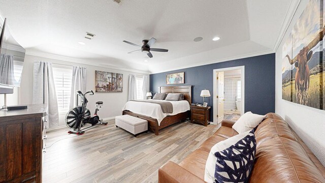 bedroom with connected bathroom, ceiling fan, light hardwood / wood-style flooring, and crown molding