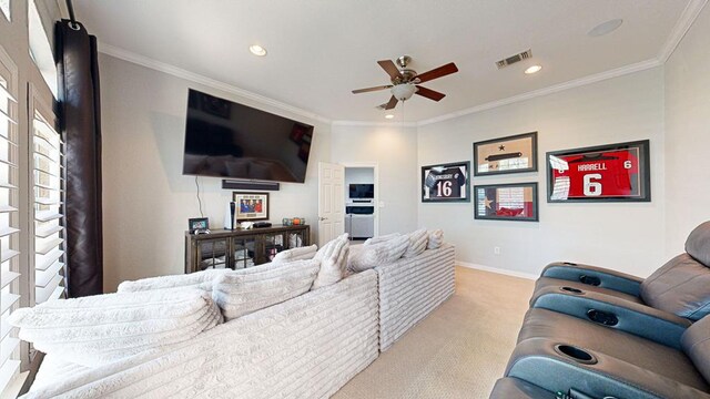 living room with light carpet, ceiling fan, and ornamental molding