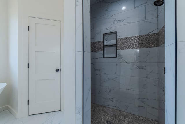 1708 E Main St, Brownfield, TX 79316 - full bathroom with tiled shower, marble finish flooring, and baseboards