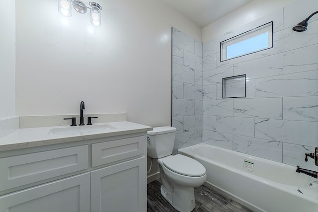 1708 E Main St, Brownfield, TX 79316 - bathroom with toilet, vanity, shower / tub combination, and wood finished floors
