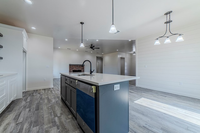 1708 E Main St, Brownfield, TX 79316 - kitchen featuring dishwasher, a sink, wood finished floors, light countertops, and recessed lighting