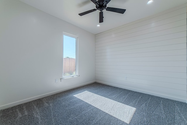 1708 E Main St, Brownfield, TX 79316 - spare room featuring carpet floors, a ceiling fan, recessed lighting, and baseboards
