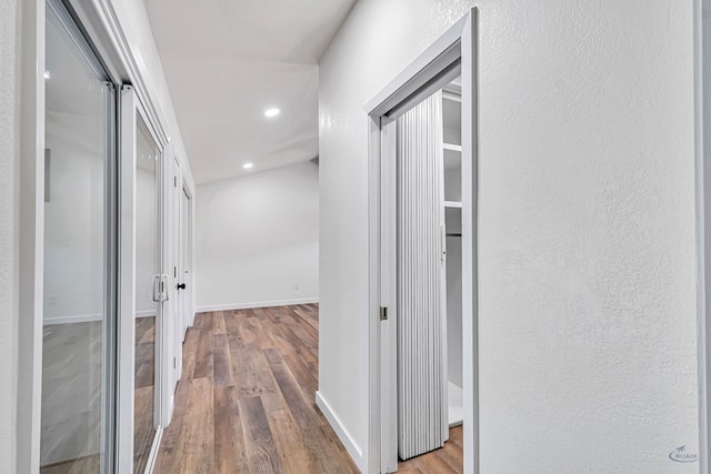 905 Mountain Park Dr, Big Spring, TX 79720 - hallway featuring wood finished floors, recessed lighting, and baseboards