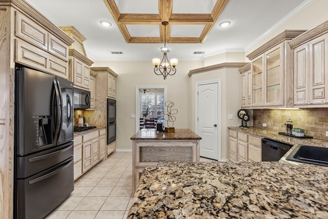 kitchen featuring light tile patterned flooring, black appliances, stone counters, pendant lighting, and backsplash