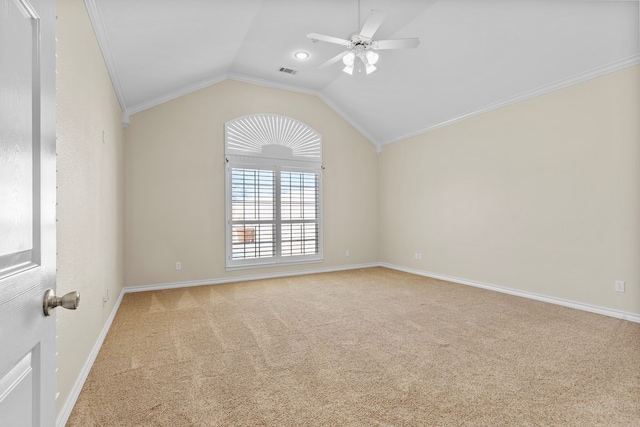 carpeted empty room with crown molding, ceiling fan, and lofted ceiling