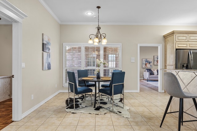 dining area featuring a notable chandelier, ornamental molding, and light tile patterned flooring