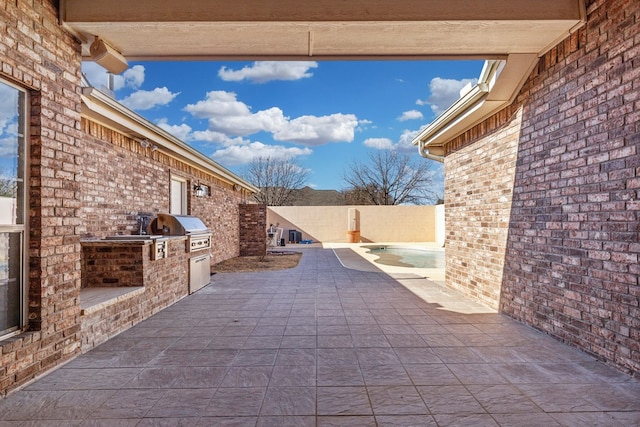 view of patio / terrace with area for grilling and an outdoor kitchen