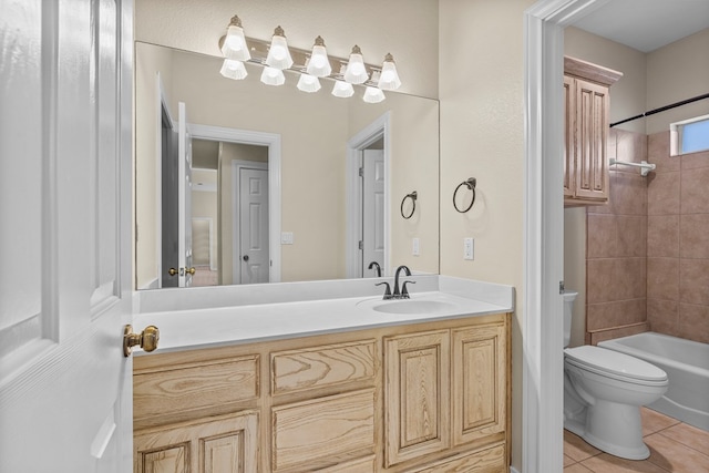 full bathroom featuring vanity, toilet, tiled shower / bath combo, and tile patterned flooring