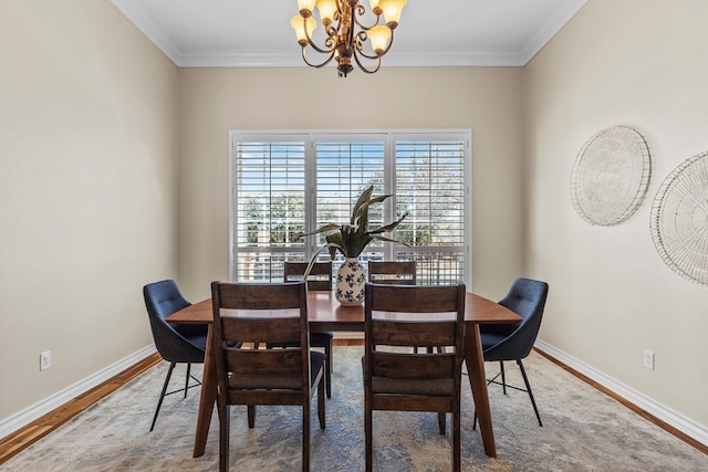 dining space with ornamental molding, wood-type flooring, and a notable chandelier