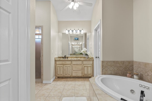 bathroom featuring vanity, tiled bath, tile patterned floors, and ceiling fan