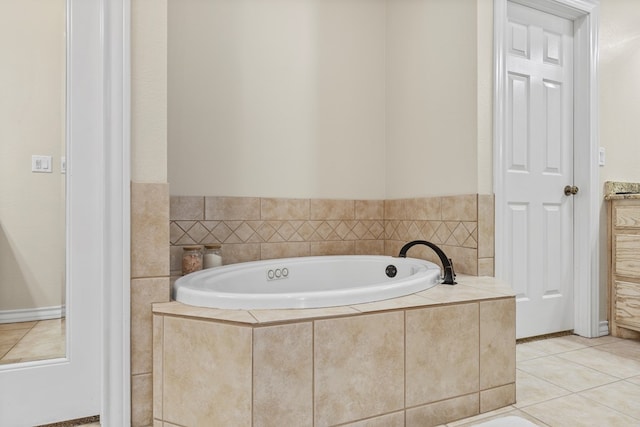 bathroom featuring tile patterned floors and tiled bath