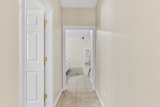 hallway with light tile patterned floors