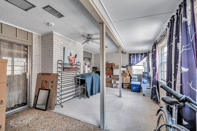 view of patio / terrace featuring a ceiling fan and visible vents