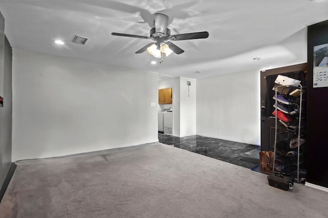 empty room featuring ceiling fan and washing machine and dryer