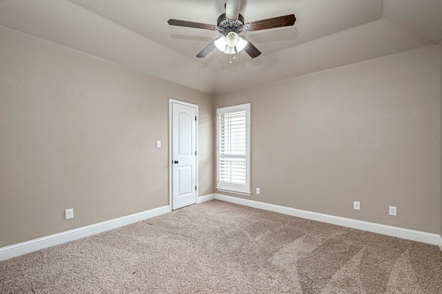 unfurnished room with vaulted ceiling, baseboards, visible vents, carpet, and a ceiling fan