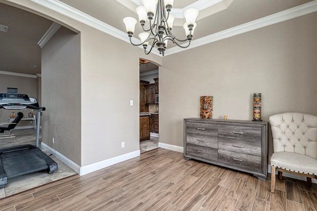 living area featuring arched walkways, visible vents, baseboards, and ceiling fan with notable chandelier