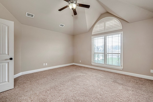 unfurnished room featuring lofted ceiling, carpet floors, a ceiling fan, and baseboards