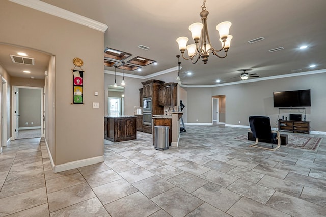 kitchen featuring stainless steel appliances, light stone countertops, crown molding, a center island, and decorative backsplash