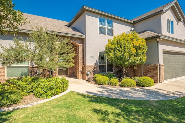 1221 Porterfield Rd, Midland, TX 79705 - traditional-style house with brick siding, stucco siding, and a front yard