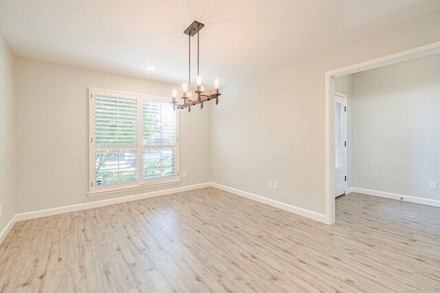 1221 Porterfield Rd, Midland, TX 79705 - spare room with a chandelier, wood finished floors, baseboards, and recessed lighting