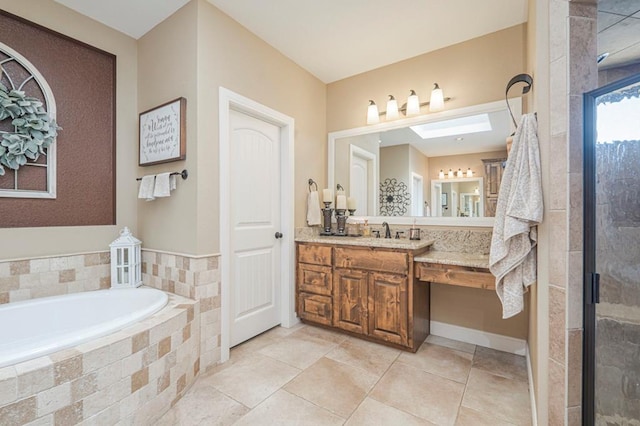 bathroom featuring vanity, a skylight, and independent shower and bath