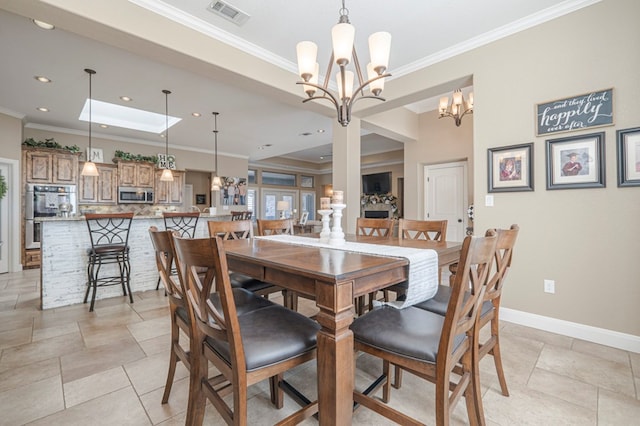 dining room featuring crown molding and an inviting chandelier